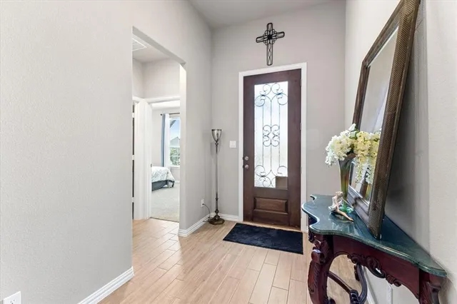 a view of an entryway with wooden floor