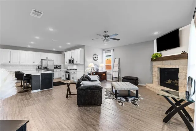 a living room with furniture and a fireplace