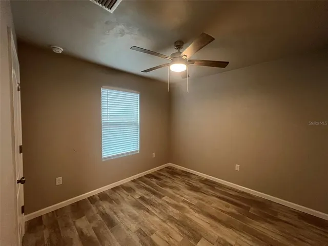 a view of empty room with windows
