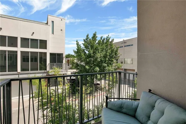 a view of a balcony with a potted plant