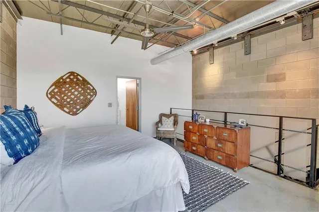 a view of a balcony with flower plants