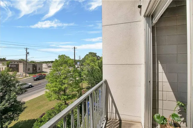 a bathroom with a toilet a sink a mirror a vanity and shower