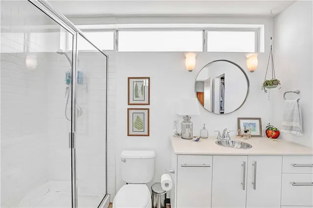 a view of a bathroom with a sink and a mirror