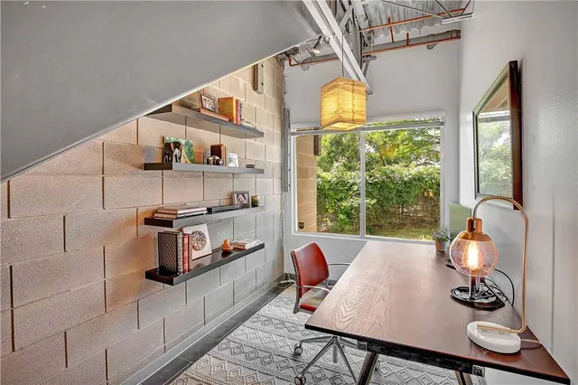 a workspace with furniture and a window