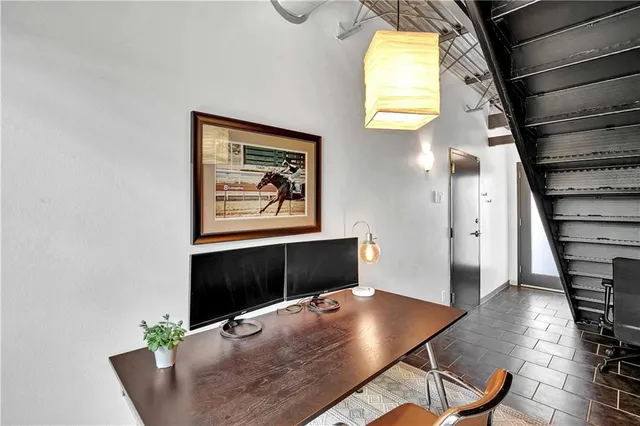 a front view of a house with a yard and a garage