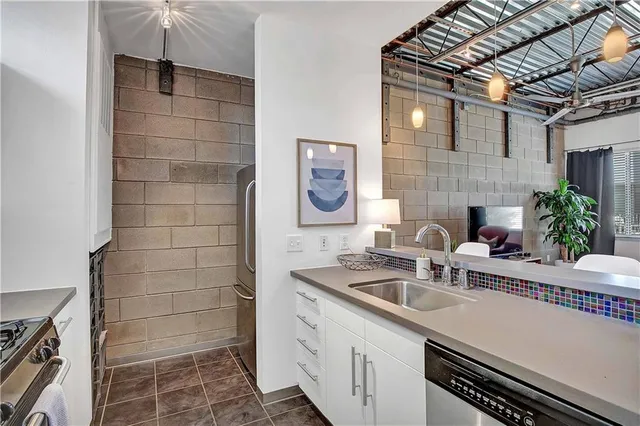 a kitchen with a sink and cabinets