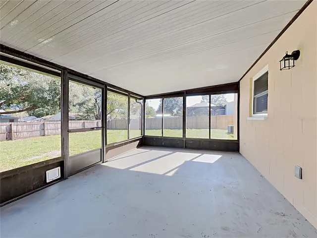 a view of an empty room with a large window
