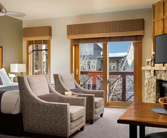 a living room with furniture a flat screen tv and a table