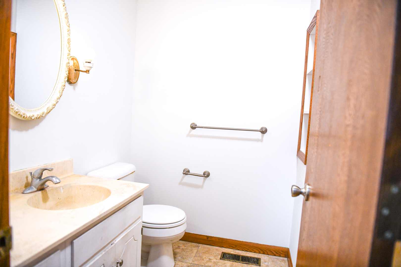 107 Walnut Street Penfield, IL 61862 - Photo 13 of 34 a bathroom with a sink and a mirror