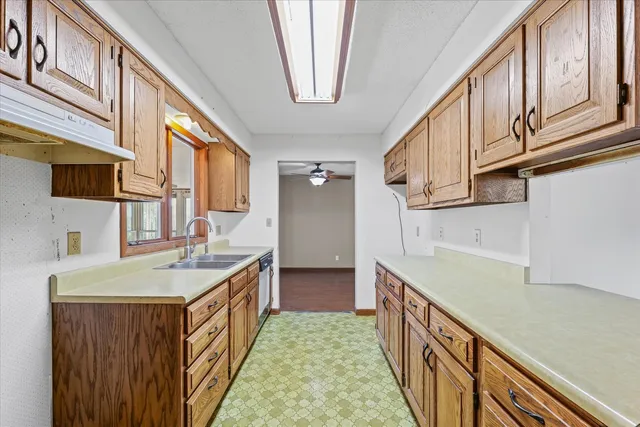 a bathroom with double vanity and a sink