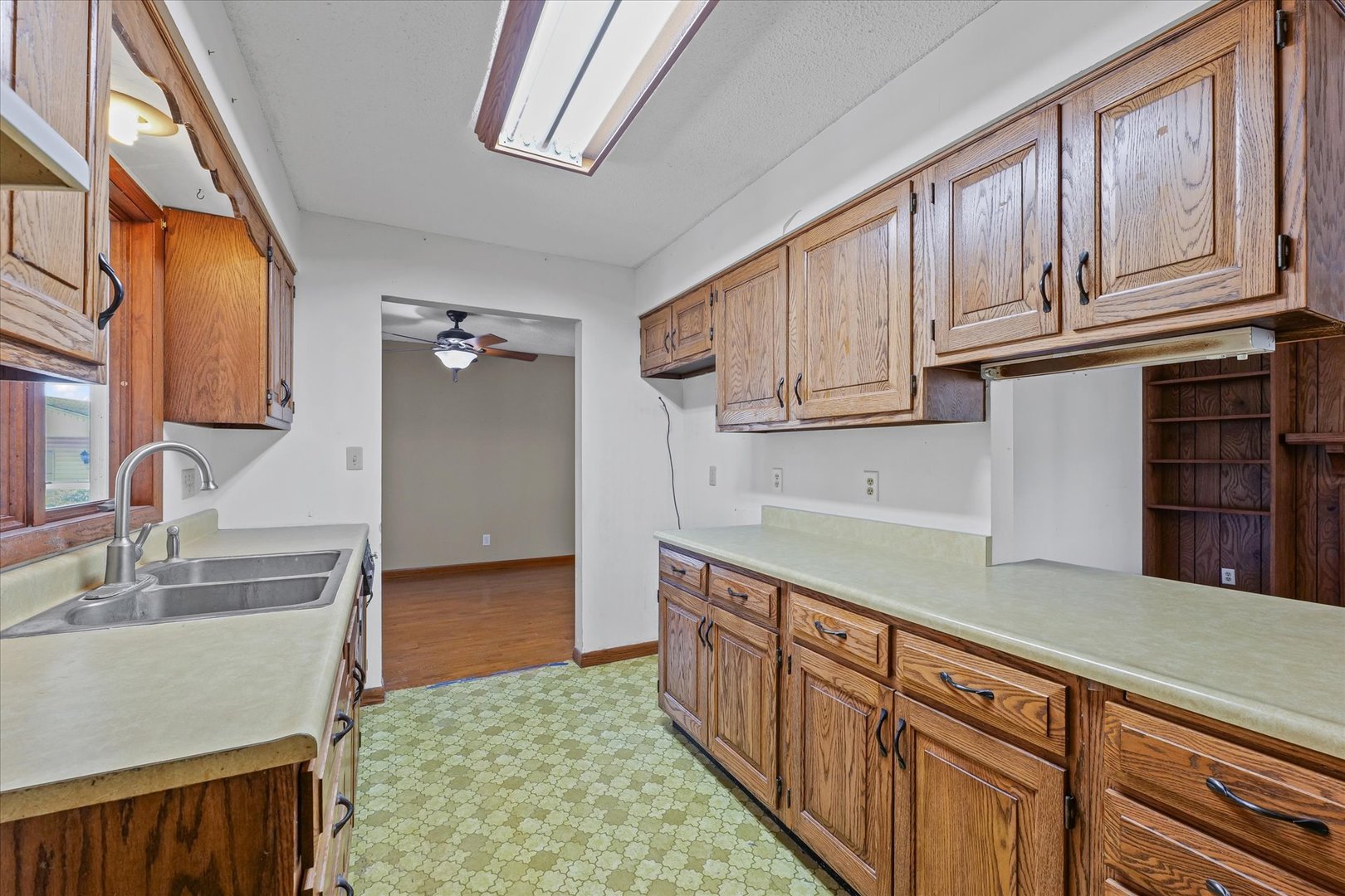 107 Walnut Street Penfield, IL 61862 - Photo 16 of 34 a kitchen with stainless steel appliances granite countertop a sink dishwasher stove and cabinets