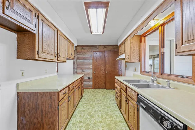 a kitchen with a sink and a window