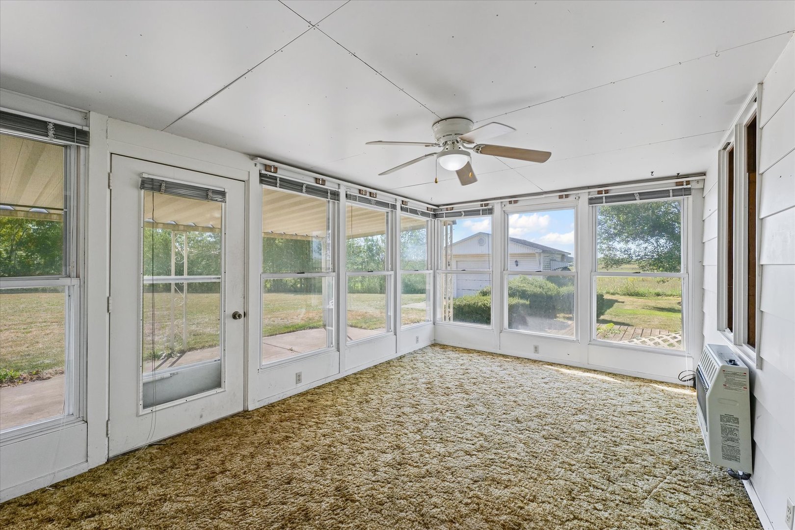 107 Walnut Street Penfield, IL 61862 - Photo 18 of 34 a view of empty room with wooden floor and fan