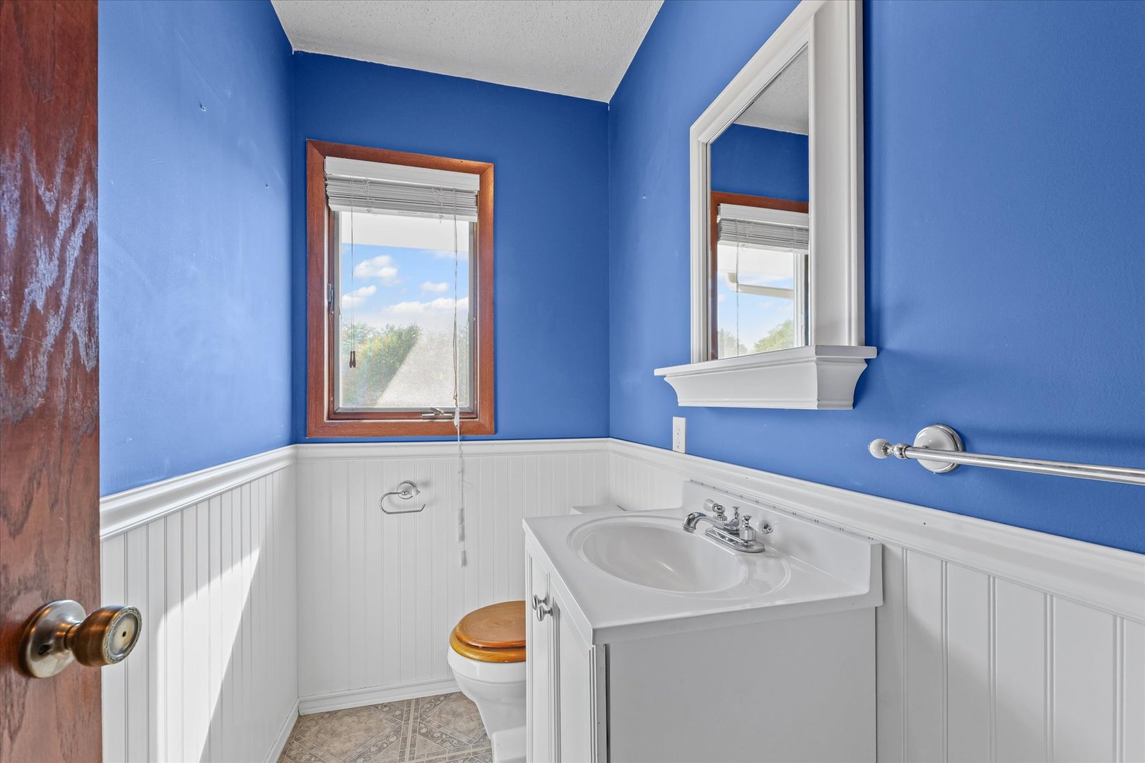 107 Walnut Street Penfield, IL 61862 - Photo 19 of 34 a bathroom with a sink and a window