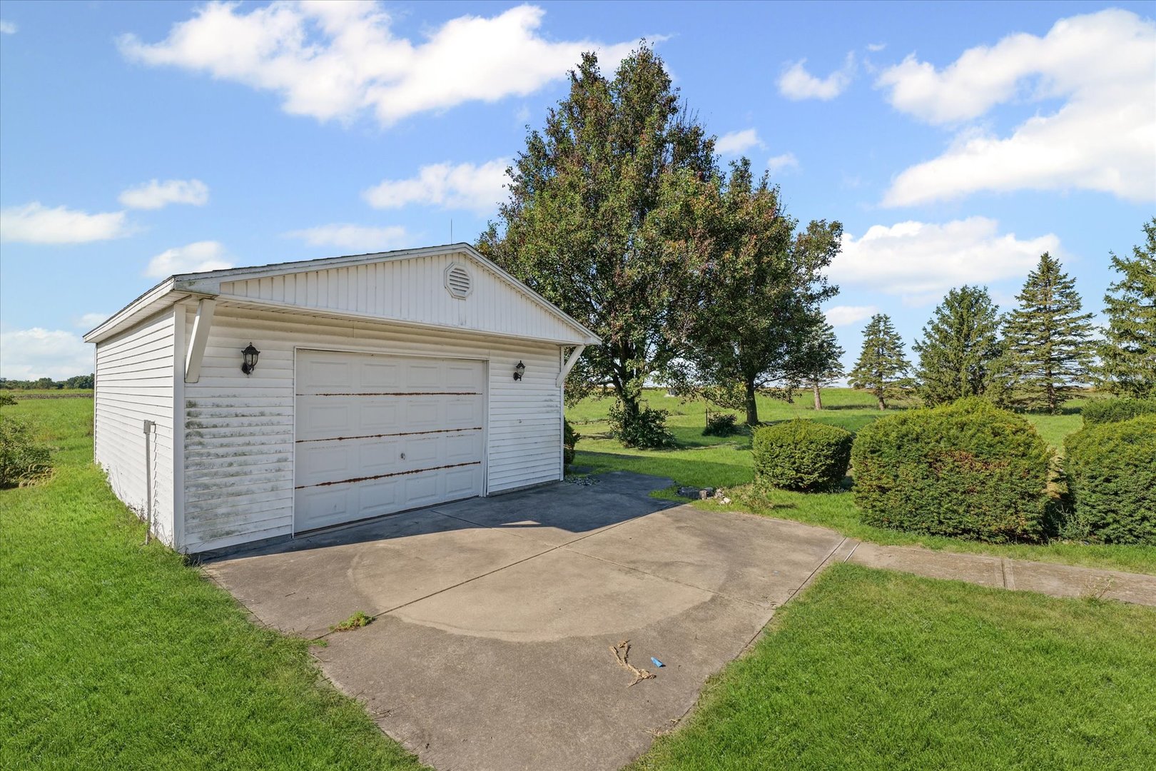 107 Walnut Street Penfield, IL 61862 - Photo 6 of 34 a view of a house with a backyard