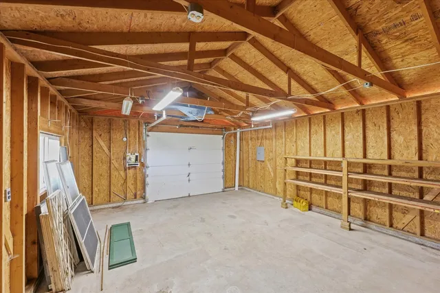 a view of a room with wooden walls