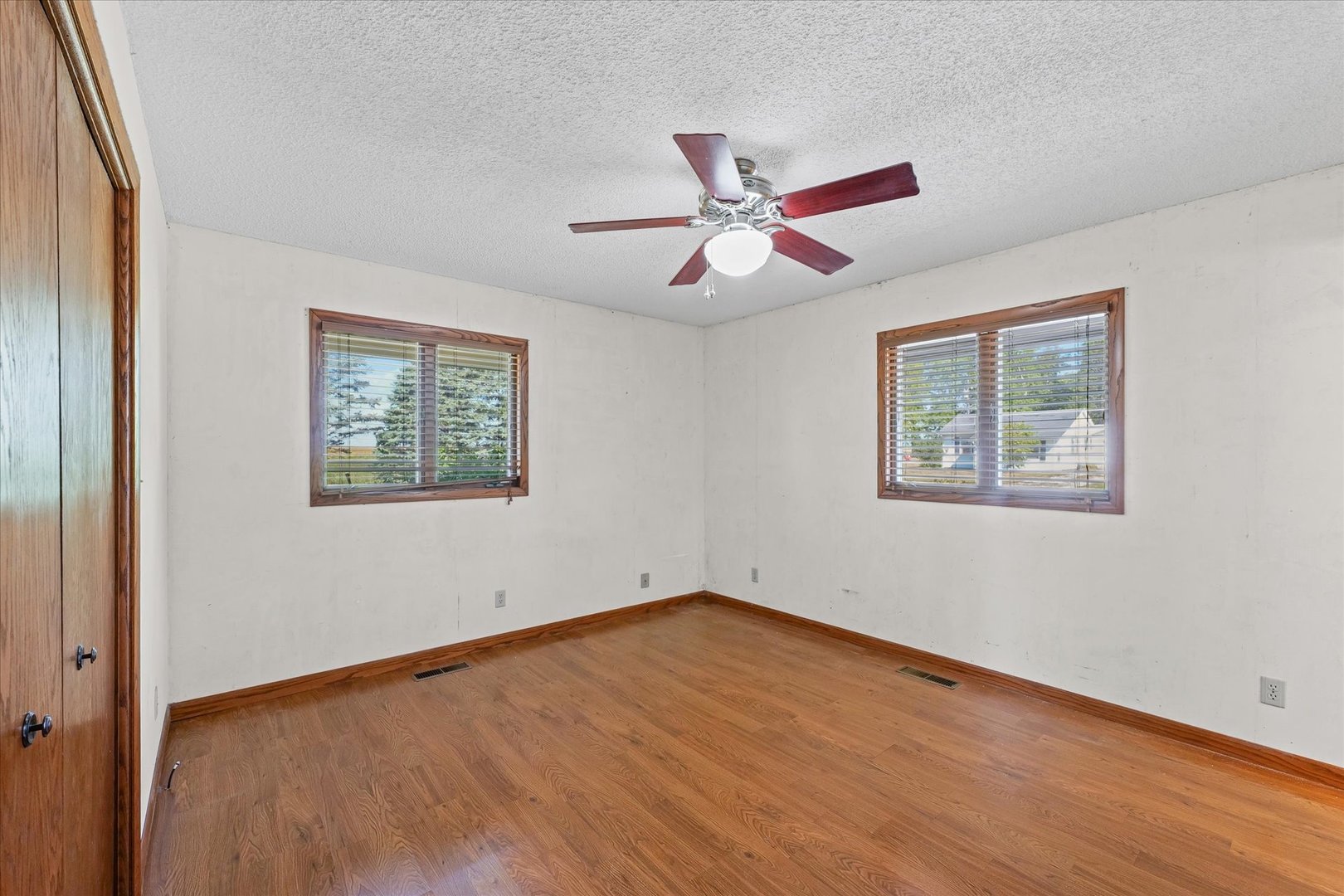 107 Walnut Street Penfield, IL 61862 - Photo 8 of 34 a view of empty room with wooden floor