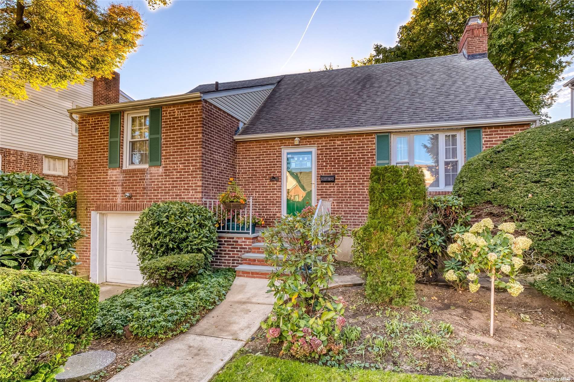 a aerial view of a house with a yard and plants
