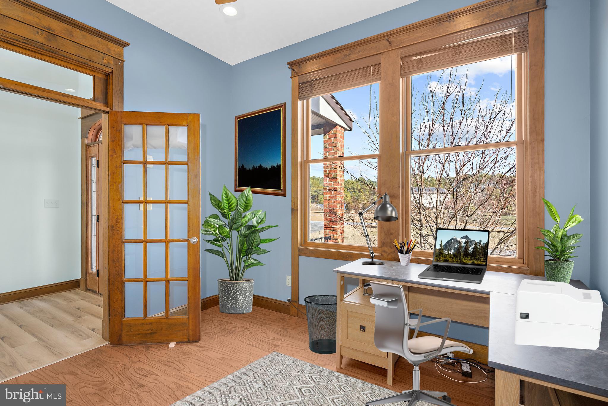 4404 Pine Top Road Madison, MD 21648 - Photo 25 of 68 a living room with furniture and large windows
