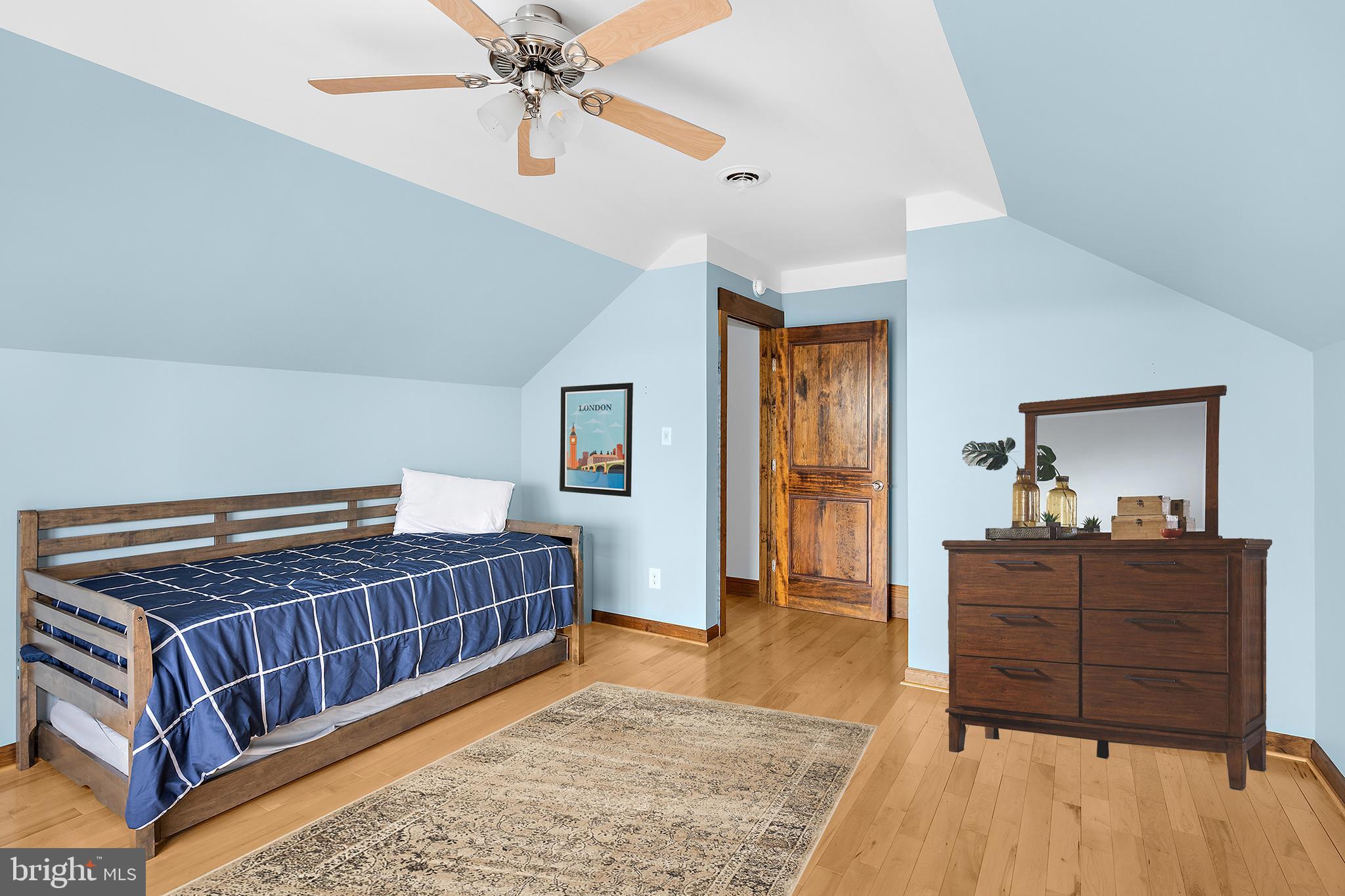 4404 Pine Top Road Madison, MD 21648 - Photo 27 of 68 a bedroom with a bed and dresser