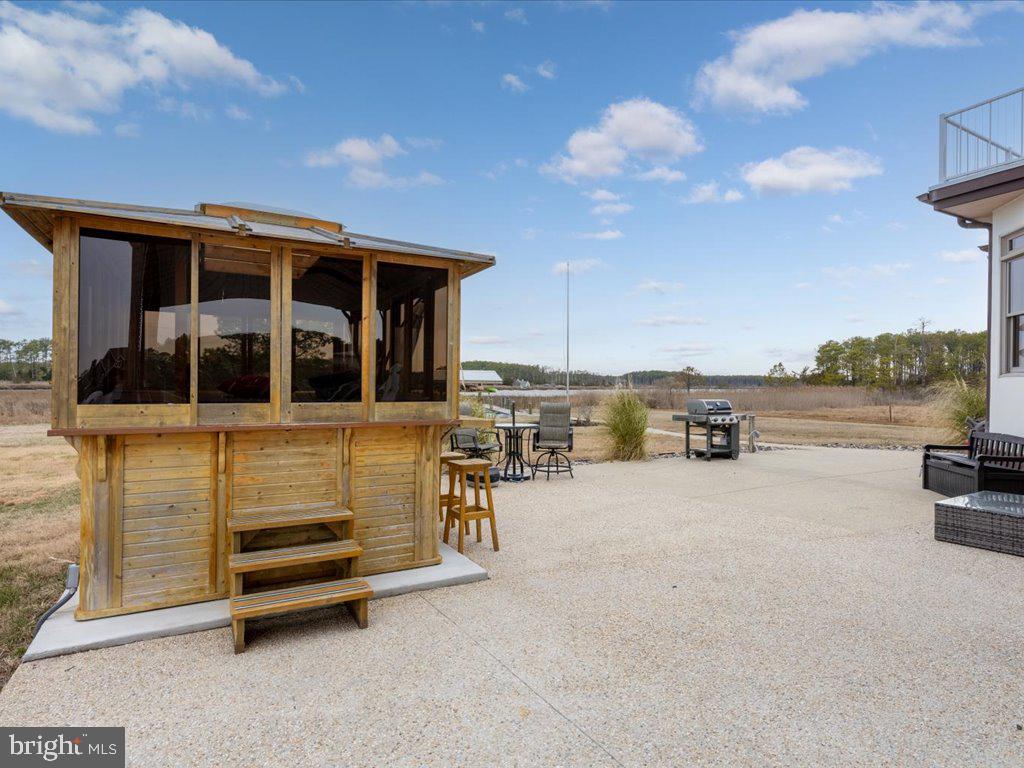 4404 Pine Top Road Madison, MD 21648 - Photo 35 of 68 a view of a house with outdoor space and sitting area