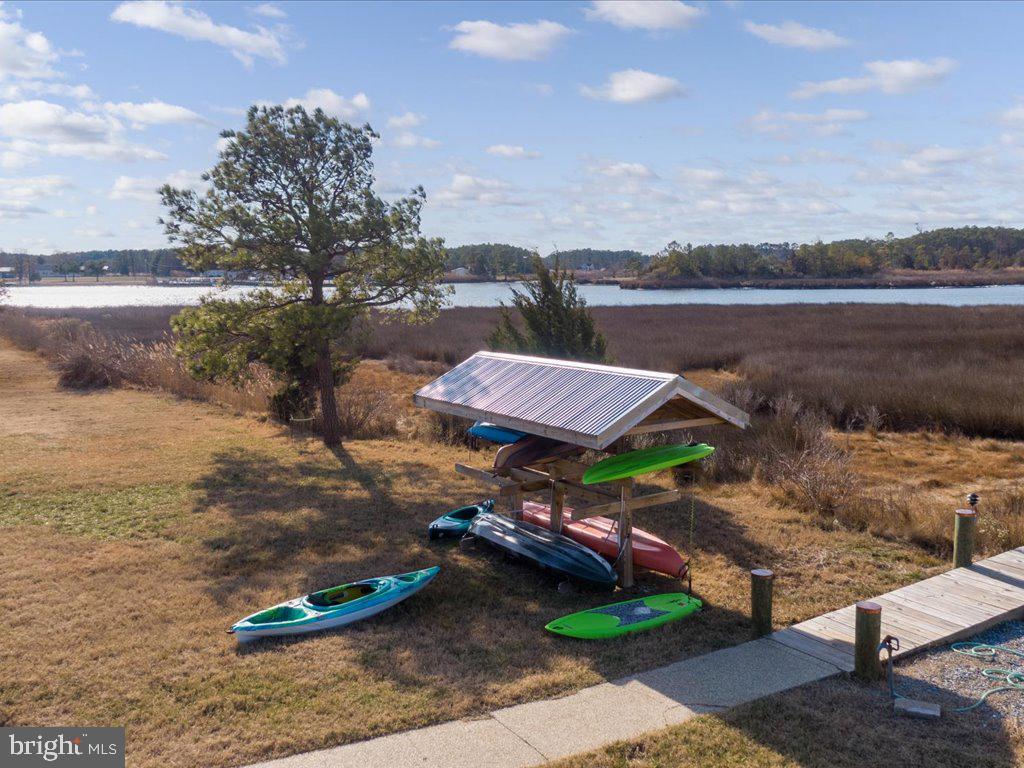 4404 Pine Top Road Madison, MD 21648 - Photo 40 of 68 a view of a lake with lawn chairs