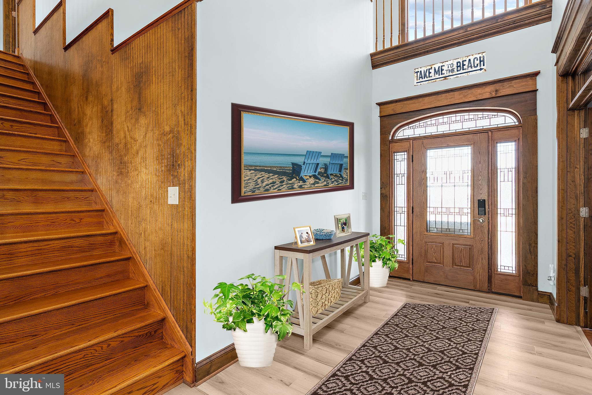 4404 Pine Top Road Madison, MD 21648 - Photo 4 of 68 a view of a hallway with wooden floor and windows