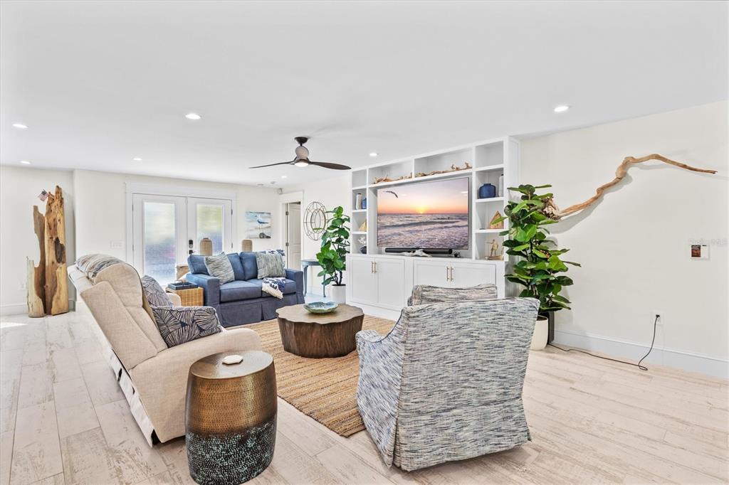506 58th Street Holmes Beach, FL 34217 - Photo 11 of 96 a living room with furniture and a flat screen tv