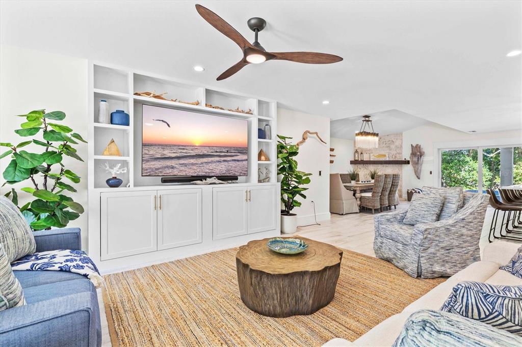 506 58th Street Holmes Beach, FL 34217 - Photo 13 of 95 a living room with furniture and a flat screen tv