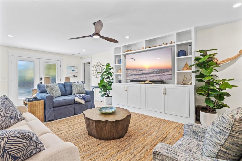 506 58th Street Holmes Beach, FL 34217 - Photo 16 of 95 a living room with furniture and a flat screen tv