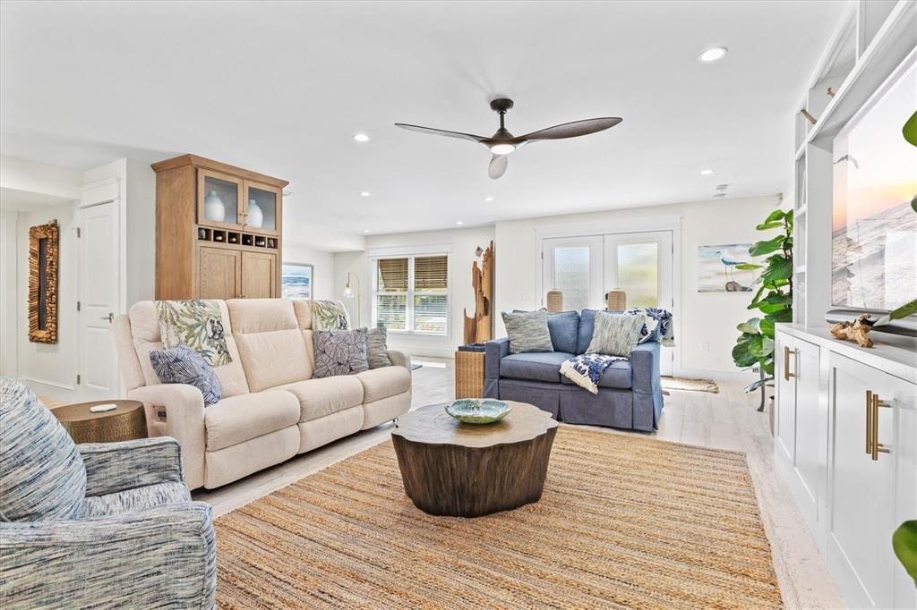 506 58th Street Holmes Beach, FL 34217 - Photo 17 of 95 a living room with furniture and a wooden floor