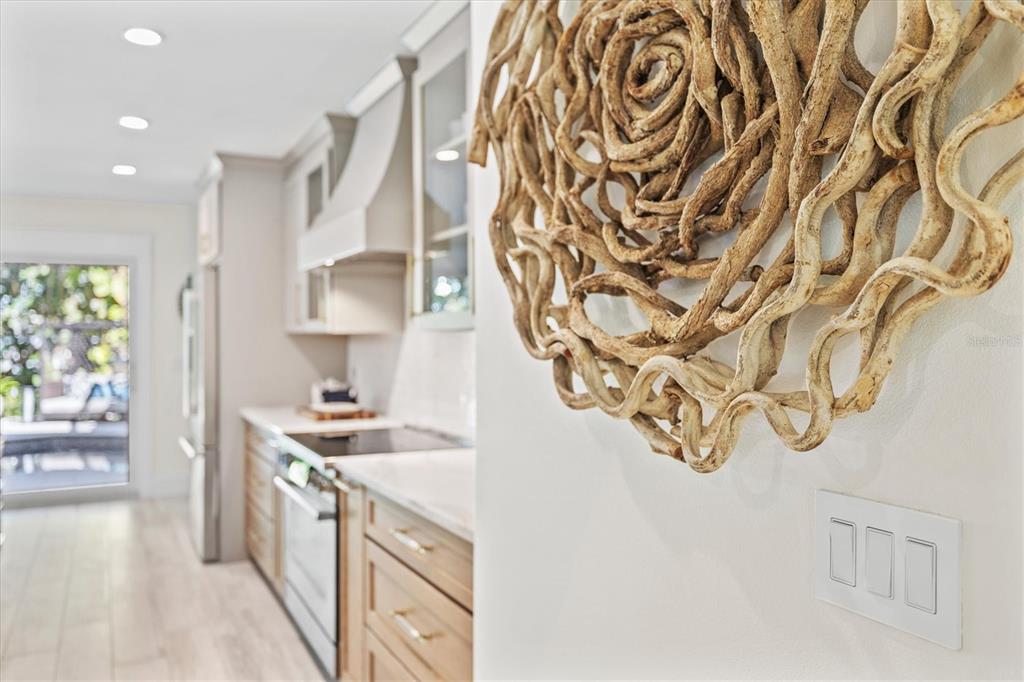 506 58th Street Holmes Beach, FL 34217 - Photo 25 of 96 a kitchen with a sink a stove and a refrigerator