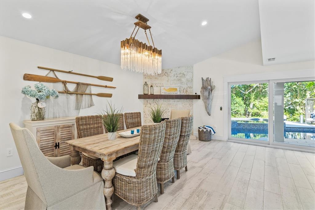 506 58th Street Holmes Beach, FL 34217 - Photo 28 of 96 a view of a dining room with furniture window and outside view