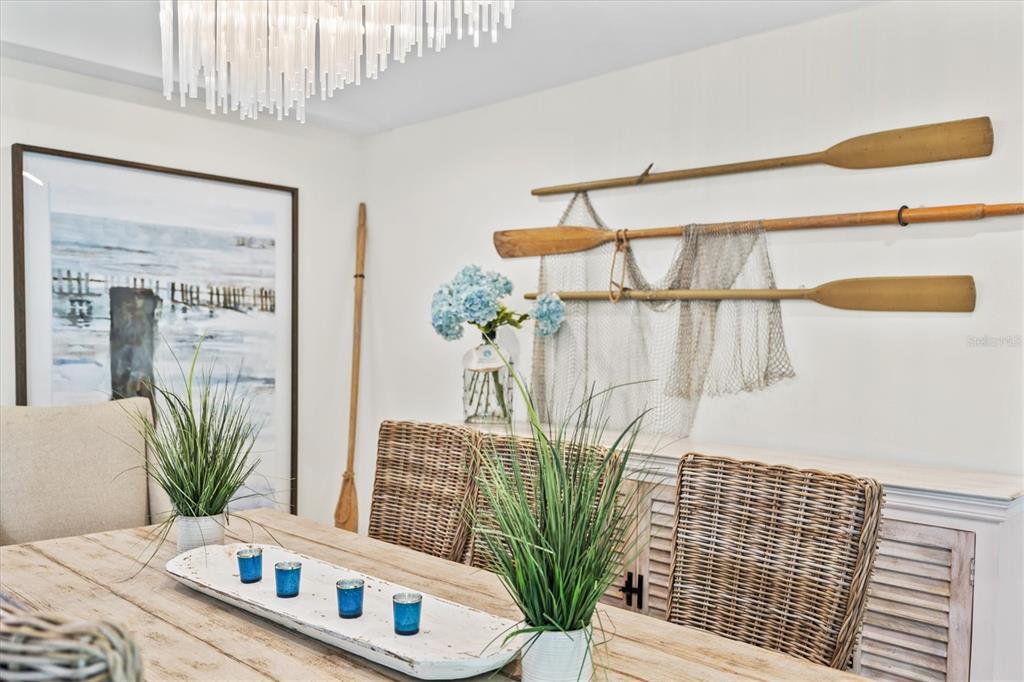 506 58th Street Holmes Beach, FL 34217 - Photo 33 of 95 a living room with furniture and a potted plant