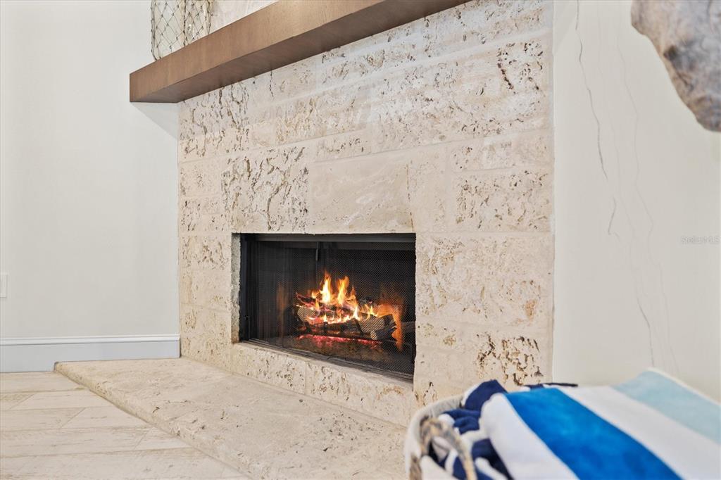 506 58th Street Holmes Beach, FL 34217 - Photo 37 of 95 a living room with a fireplace