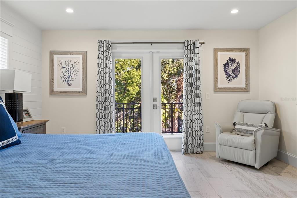 506 58th Street Holmes Beach, FL 34217 - Photo 45 of 96 a bedroom with a bed and a couch