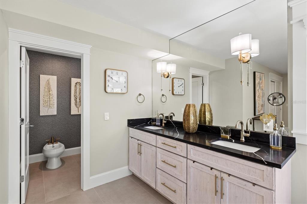 506 58th Street Holmes Beach, FL 34217 - Photo 54 of 96 a bathroom with a granite countertop sink and a mirror