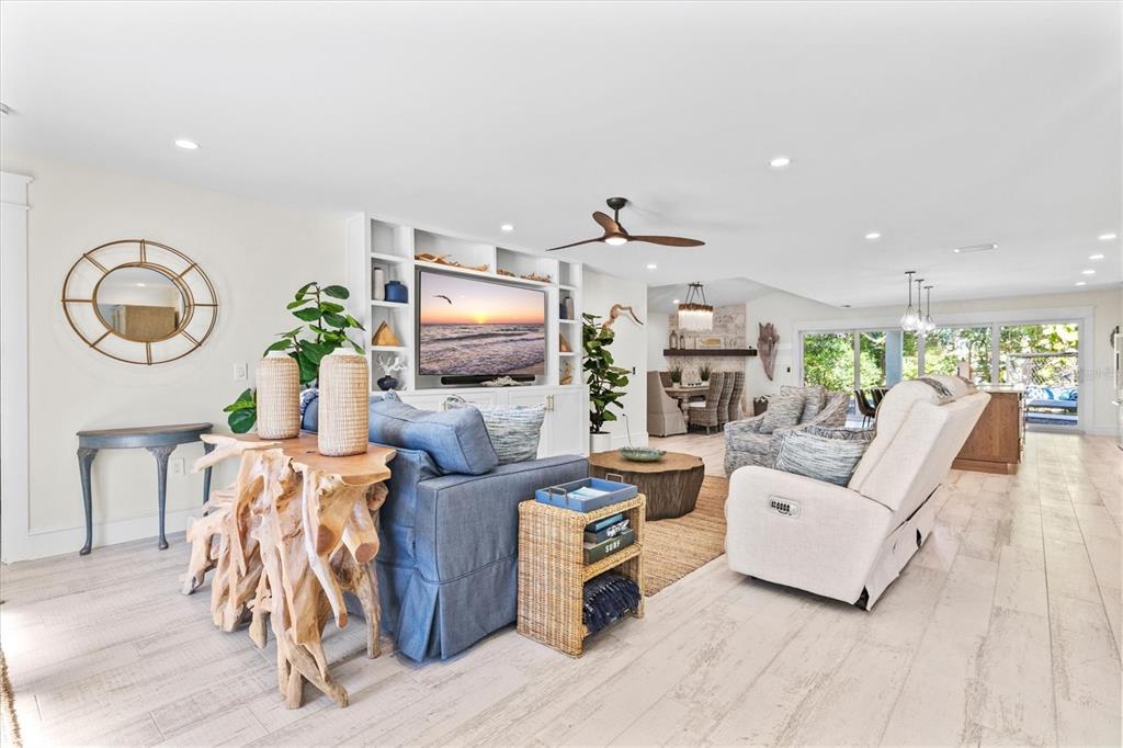 506 58th Street Holmes Beach, FL 34217 - Photo 6 of 96 a living room with furniture and a flat screen tv