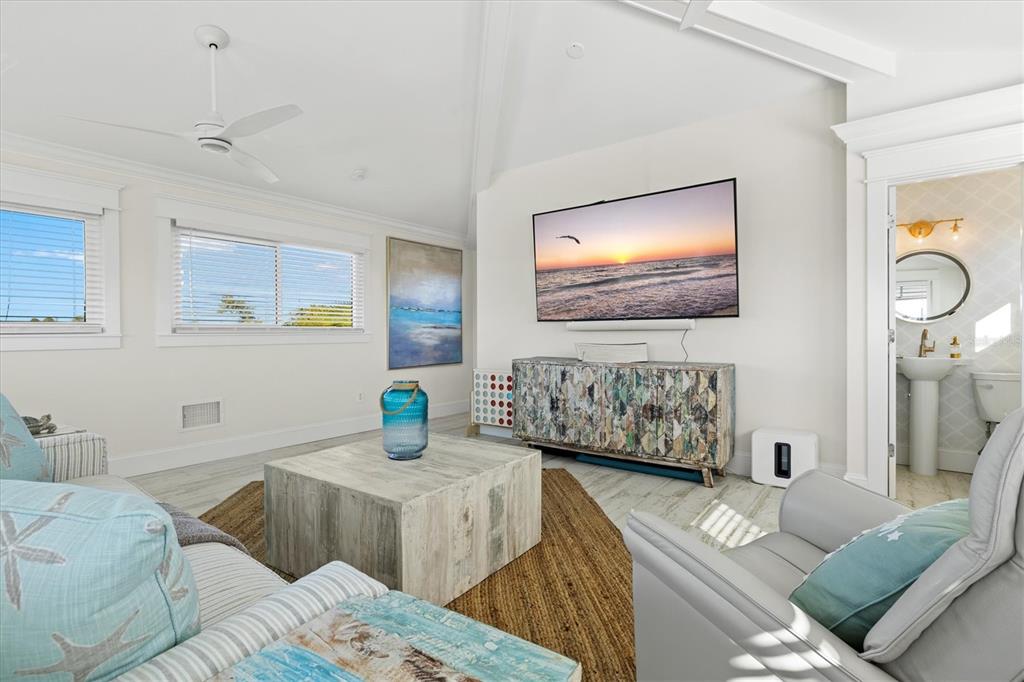 506 58th Street Holmes Beach, FL 34217 - Photo 74 of 96 a living room with furniture and a flat screen tv