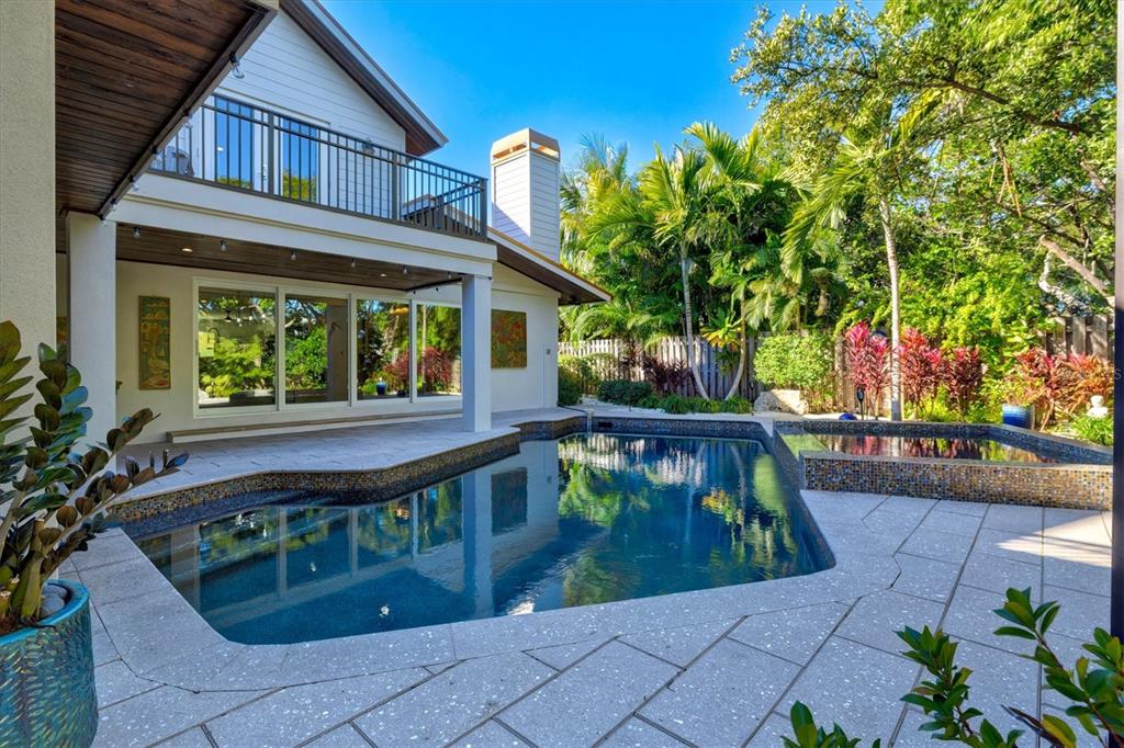 506 58th Street Holmes Beach, FL 34217 - Photo 84 of 95 front view of a house with a small yard