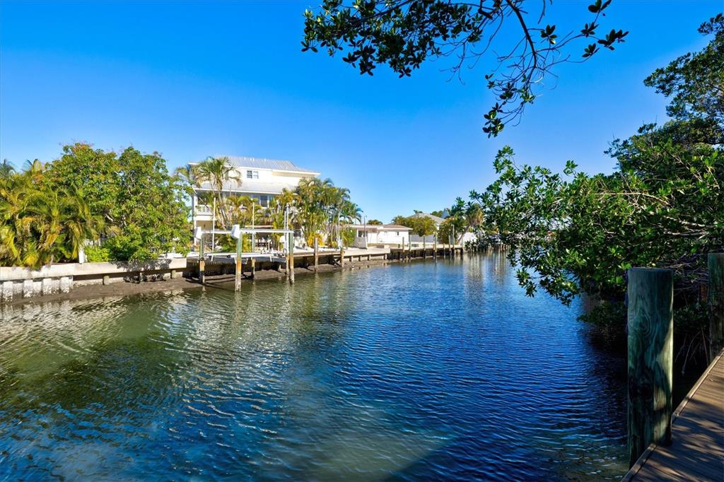 506 58th Street Holmes Beach, FL 34217 - Photo 9 of 95 a view of a lake with houses