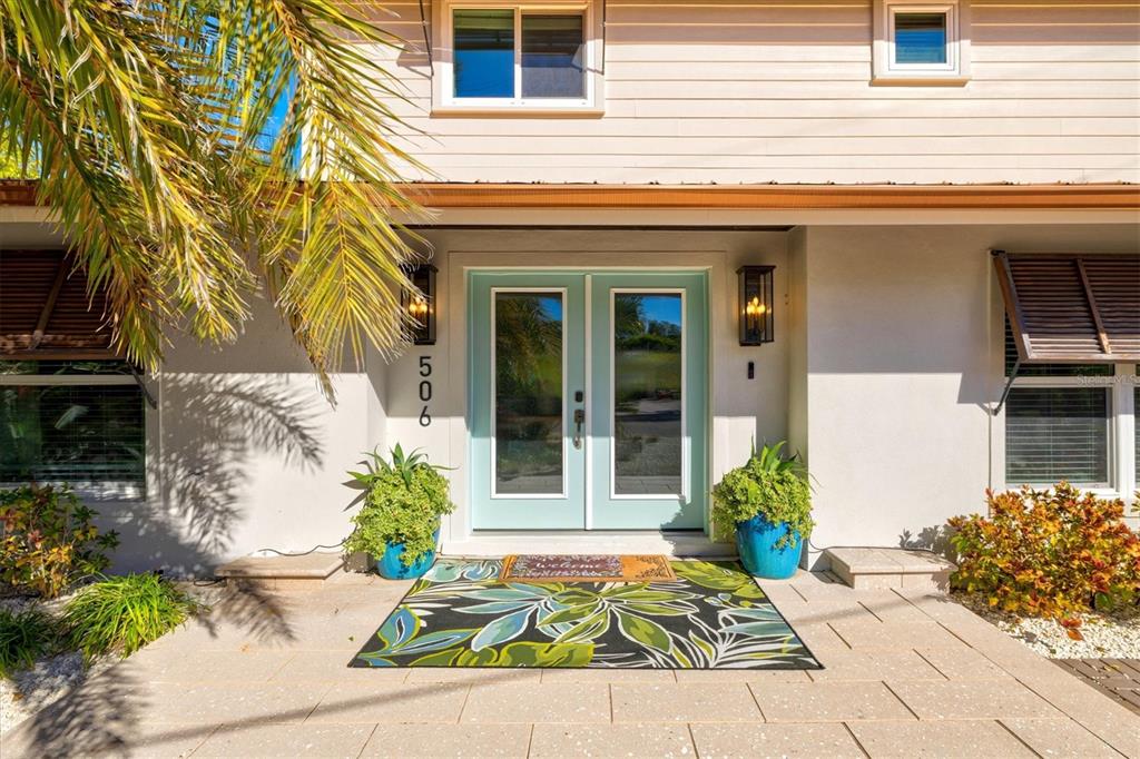 506 58th Street Holmes Beach, FL 34217 - Photo 95 of 96 a view of a entryway door front of house