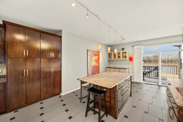 a very nice looking dining room with a large window