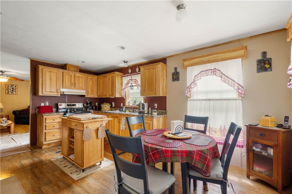 534 Finks Run Road McDonald, PA 15057 - Photo 31 of 35 a dining room with a table chairs and a kitchen view