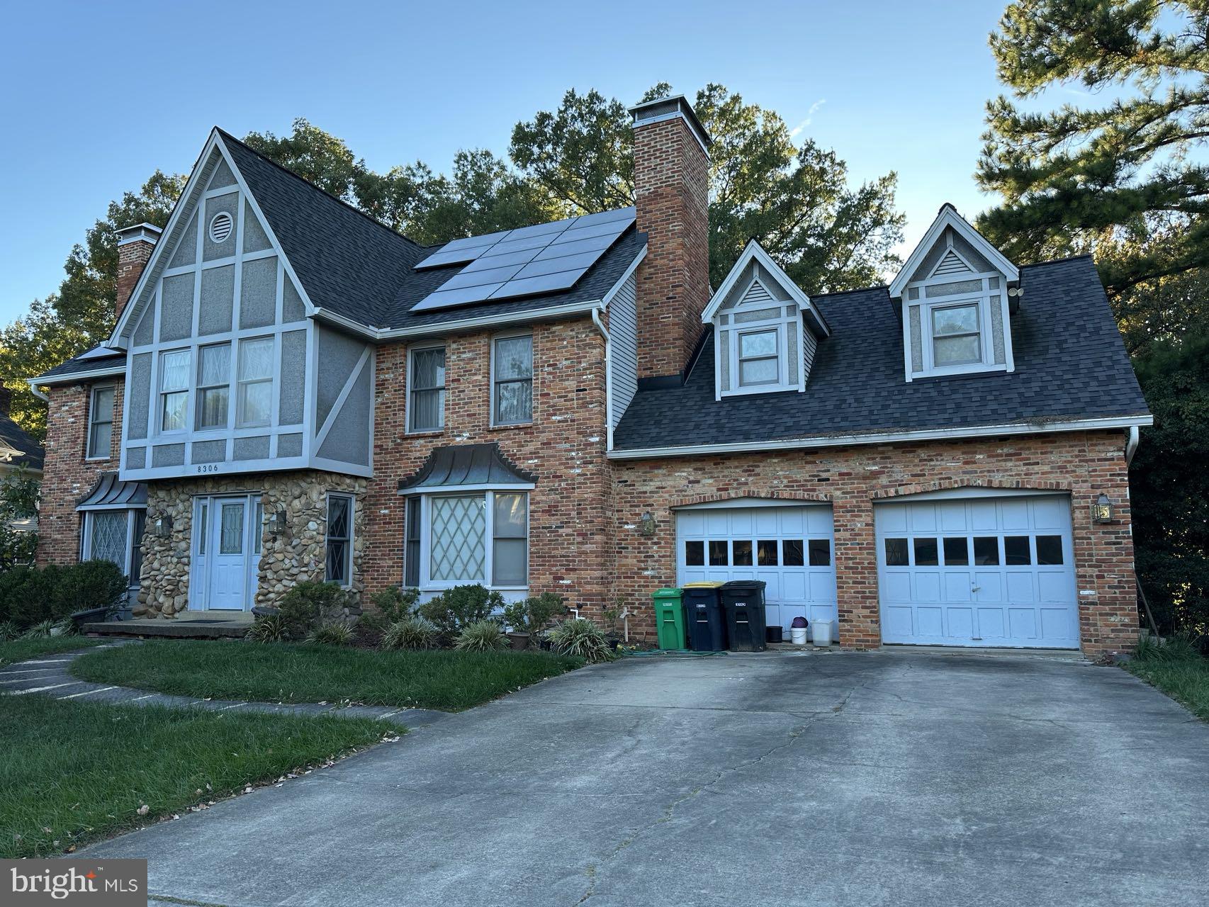 8306 Osage Terrace Adelphi, MD 20783 - Photo 1 of 6 a view of a house with a yard and garage