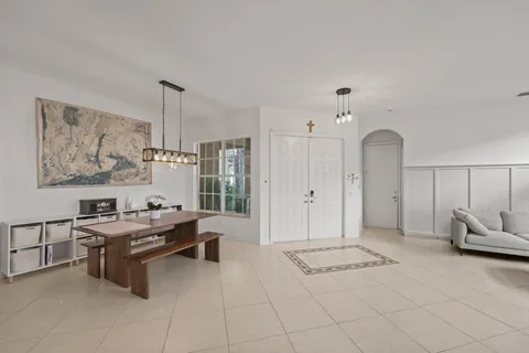 a room with furniture a air conditioner and a window