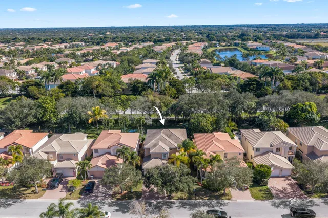 a view of a house with backyard sitting area and garden
