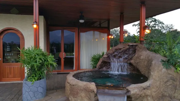 a view of a house with fountain bath tub and entertaining space