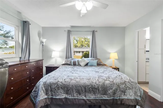 a bedroom with a large bed and a window