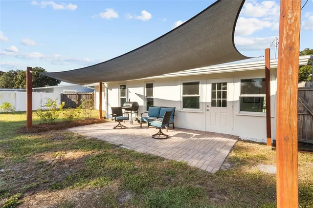 a view of a hall with dining area and front door